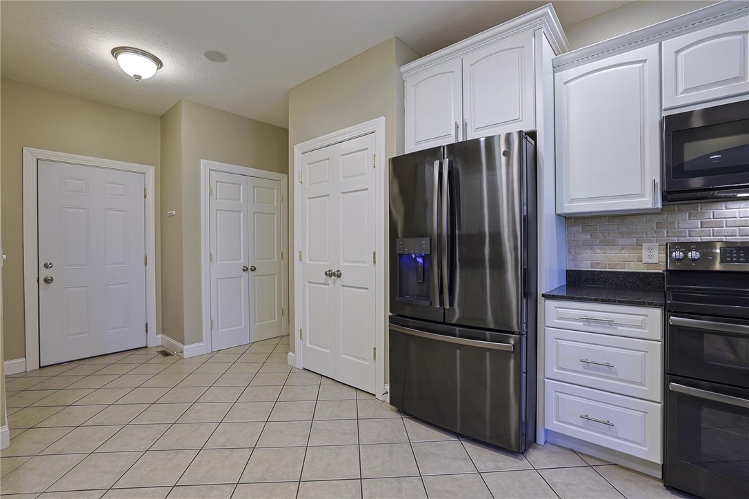 3681 Wilmington Road Lebanon, OH 45036 - Photo 16 of 87 This spacious kitchen offers ample storage and modern appliances, creating a functional culinary space.