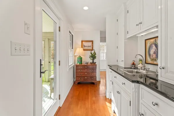 a spacious bathroom with a double vanity sink and a mirror