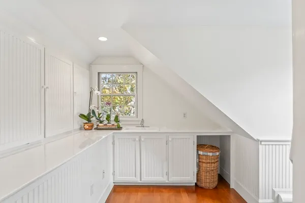 a view of an entryway with wooden floor