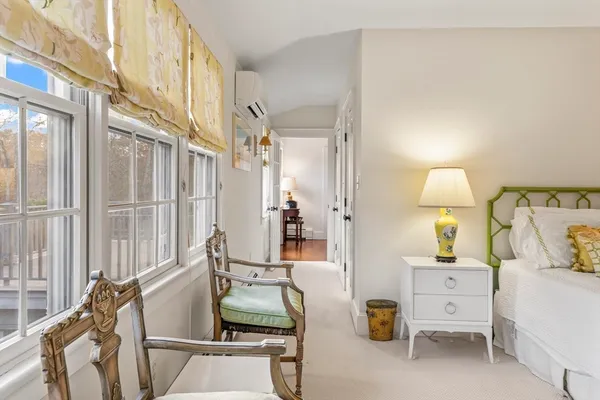 a living room with furniture and a lamp