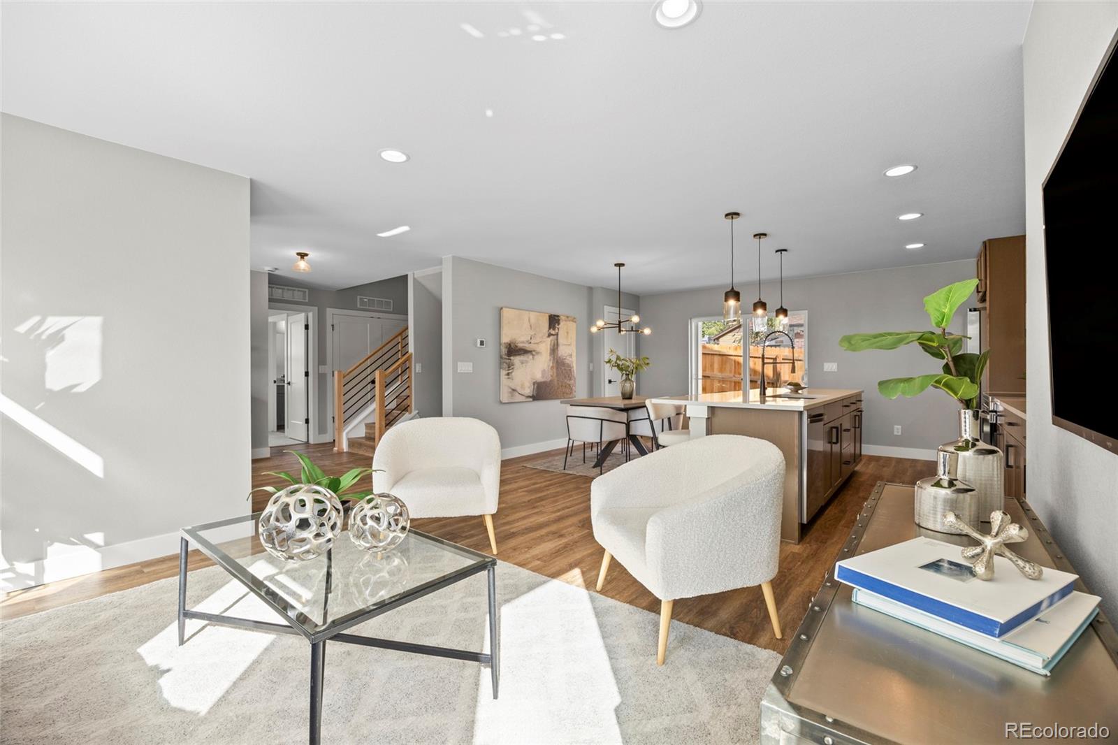 3420 Steele Street Denver, CO 80205 - Photo 13 of 50 a living room with furniture and a table