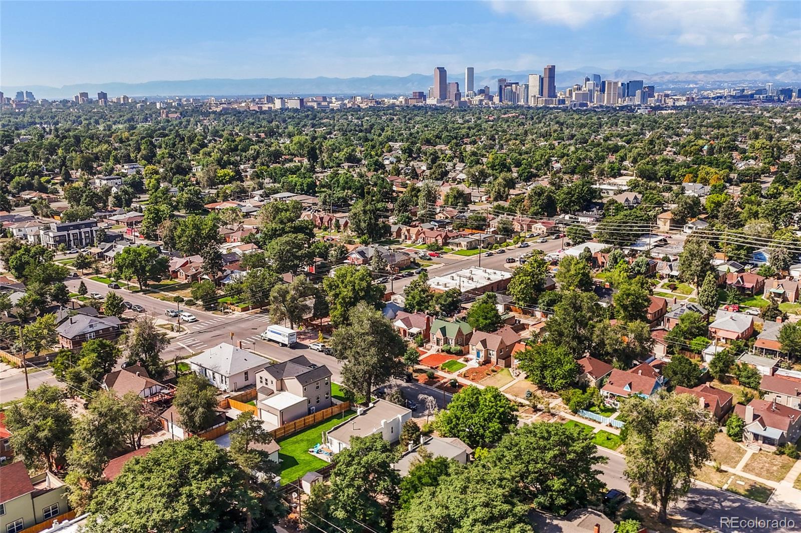 3420 Steele Street Denver, CO 80205 - Photo 46 of 50 an aerial view of a city with lots of residential buildings