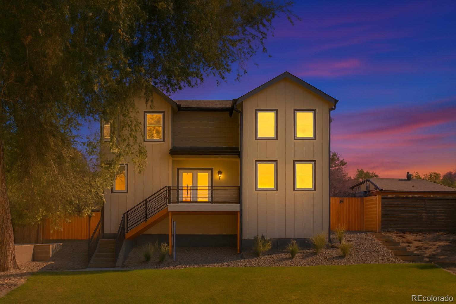 3420 Steele Street Denver, CO 80205 - Photo 5 of 50 a front view of a house with a yard