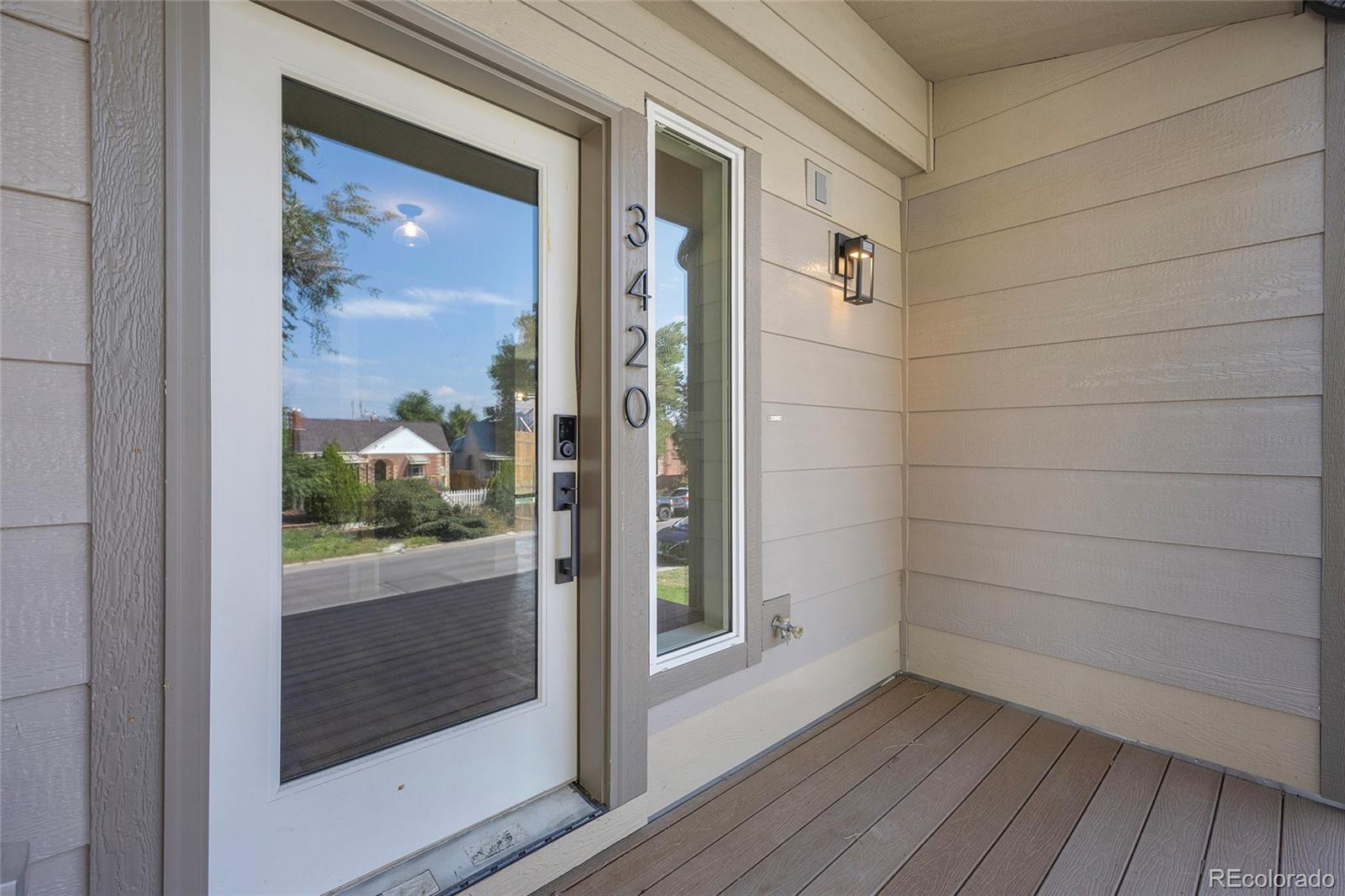 3420 Steele Street Denver, CO 80205 - Photo 7 of 50 a view of a small space with wooden floor and a bathroom view
