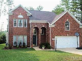 9437 Tweeds Mill Road Raleigh, NC 27617 - Photo 1 of 1 front view of a house with a yard