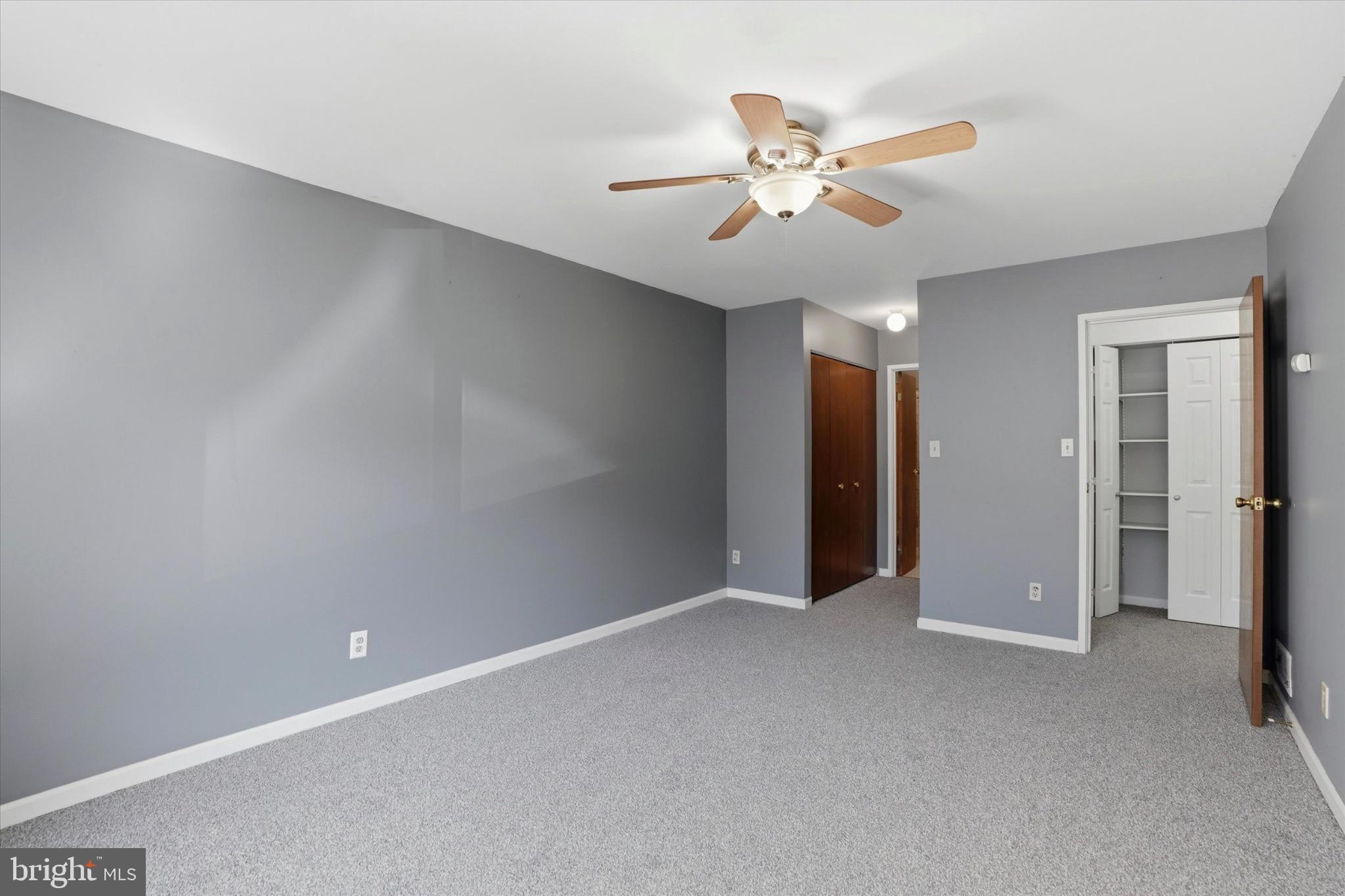 48 Muirfield Drive Reading, PA 19607 - Photo 12 of 15 a view of an empty room with a ceiling fan
