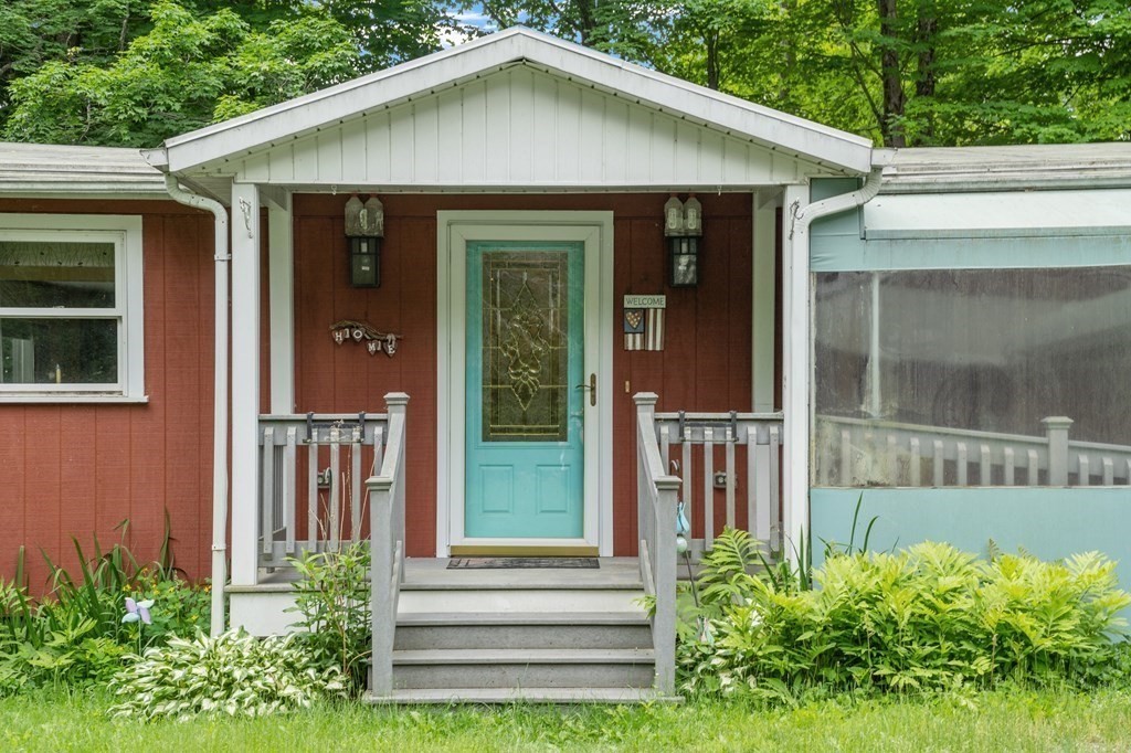 39 Island Road Lunenburg, MA 01462 - Photo 1 of 35 a front view of a house with a yard