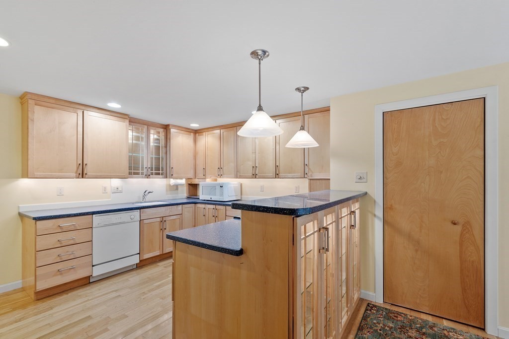 39 Island Road Lunenburg, MA 01462 - Photo 12 of 35 a kitchen with stainless steel appliances granite countertop a sink a counter space and a window