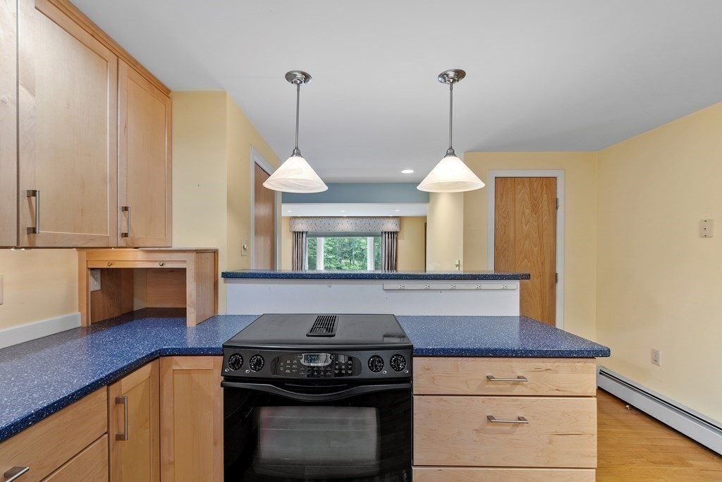 39 Island Road Lunenburg, MA 01462 - Photo 14 of 35 a kitchen with a stove and a wooden floor