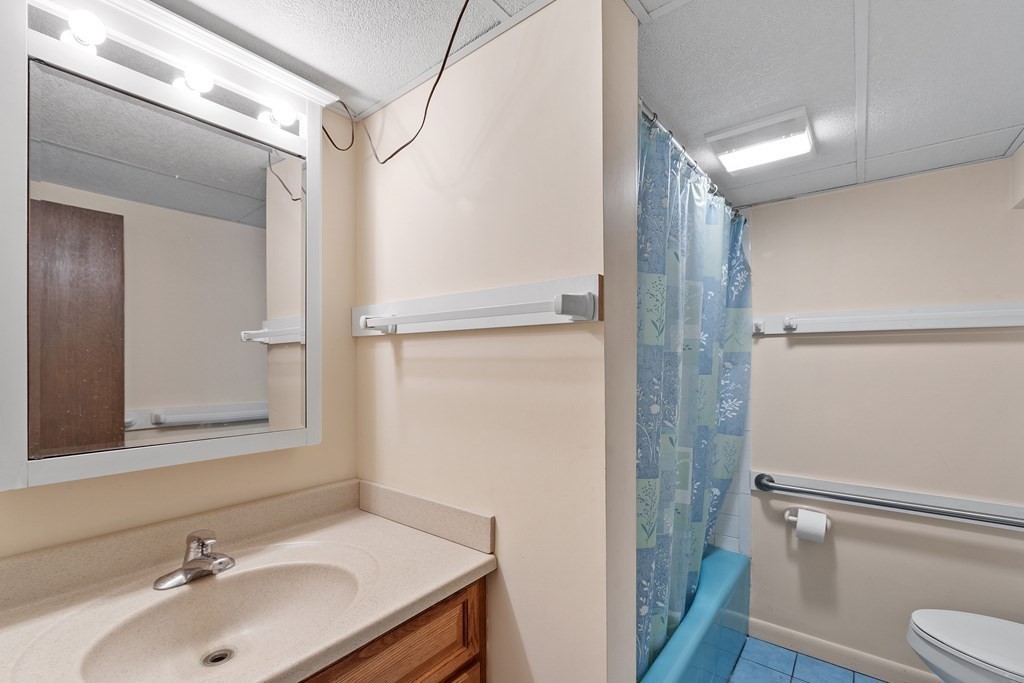 39 Island Road Lunenburg, MA 01462 - Photo 31 of 35 a bathroom with a sink toilet and shower