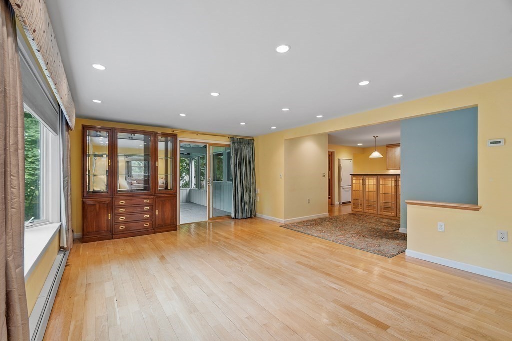 39 Island Road Lunenburg, MA 01462 - Photo 6 of 35 a view of an empty room with a sliding door and wooden floor
