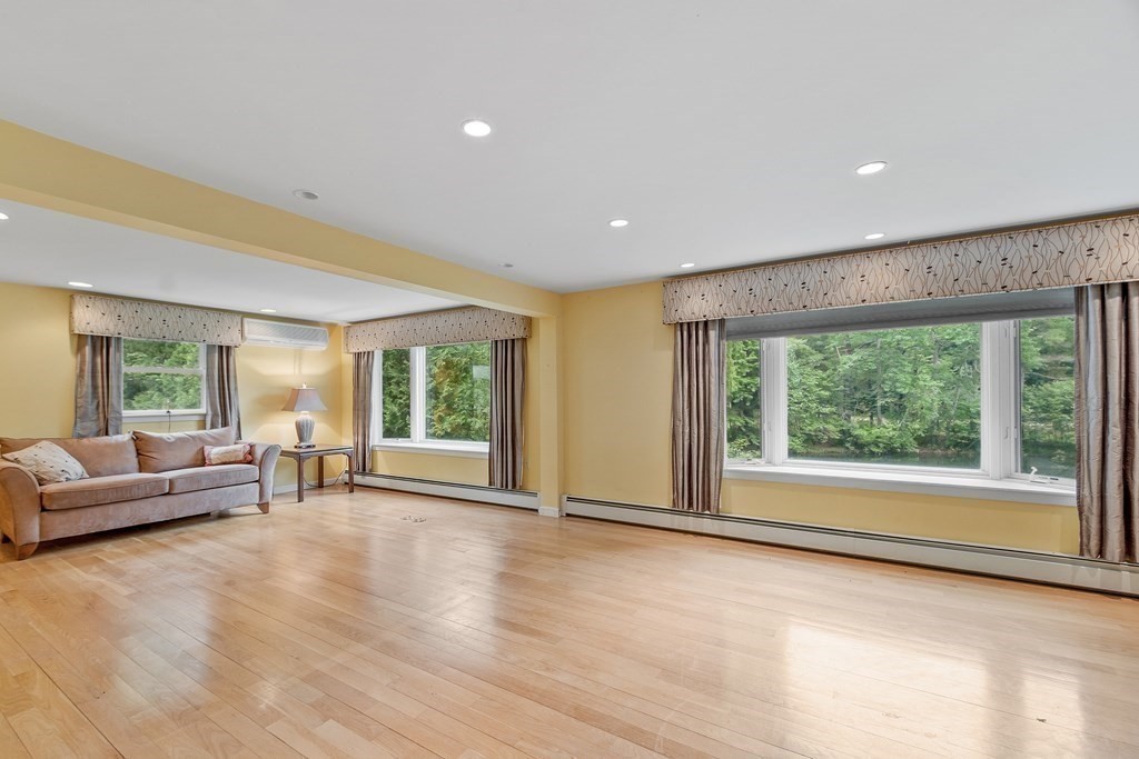 39 Island Road Lunenburg, MA 01462 - Photo 9 of 35 a view of an empty room with wooden floor and a window