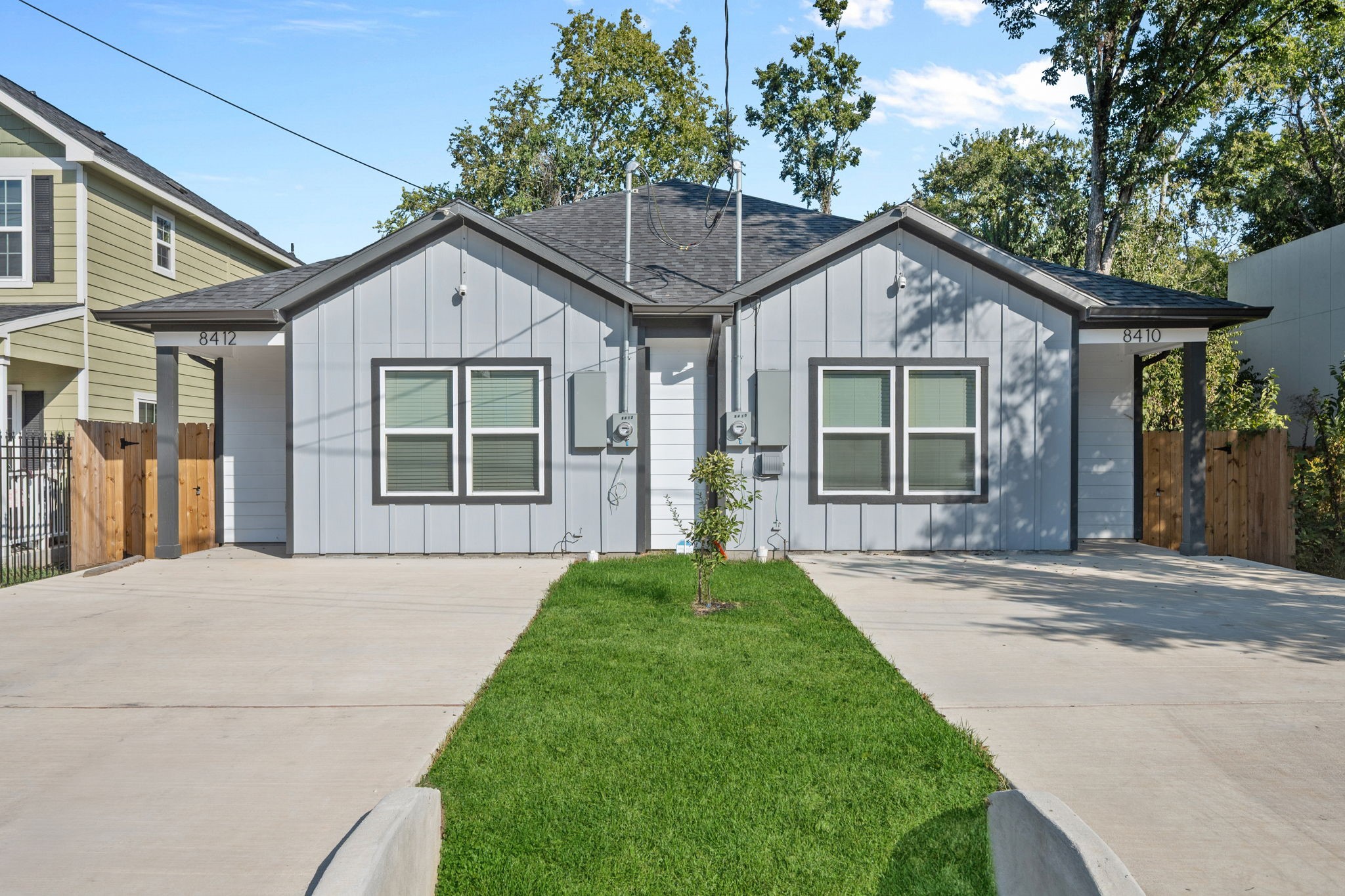 a view of a brick house with large windows