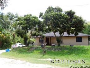 0 Burma Road New Smyrna Beach, FL 32168 - Photo 2 of 20 a front view of a house with garden