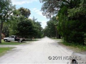 0 Burma Road New Smyrna Beach, FL 32168 - Photo 4 of 20 a view of outdoor space with sign board