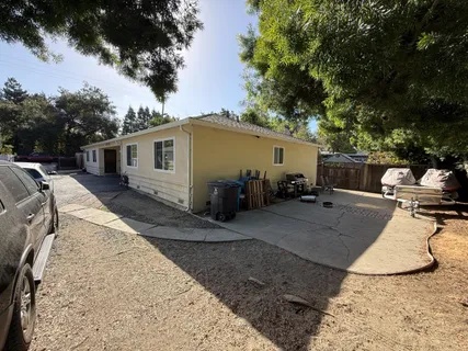 a view of a backyard with sitting area