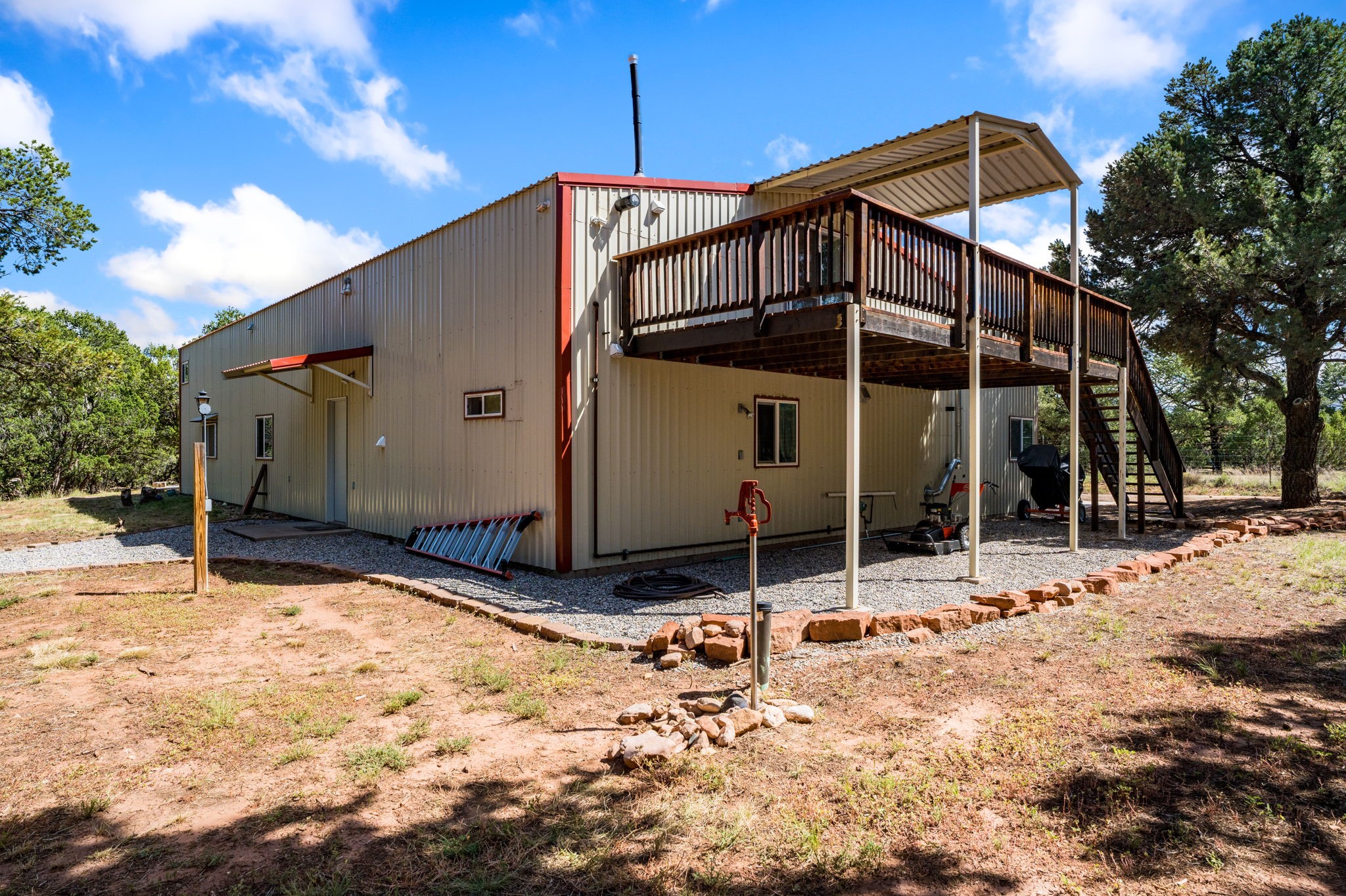 11 Blue Jay Way Rowe, NM 87562 - Photo 25 of 36 Back of Home with deck