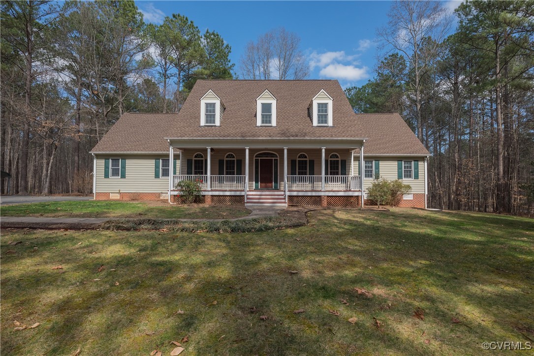 2770 Checketts Drive Sandy Hook, VA 23153 - Photo 1 of 50 a front view of a house with a garden