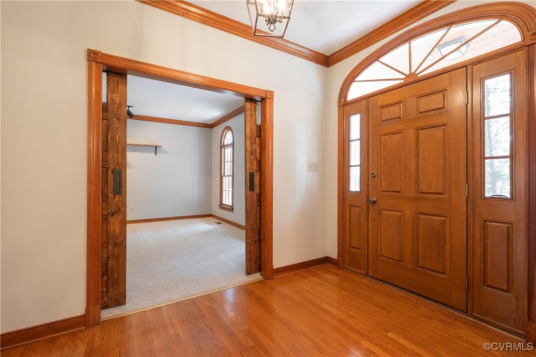2770 Checketts Drive Sandy Hook, VA 23153 - Photo 12 of 50 wooden floor and windows in an empty room