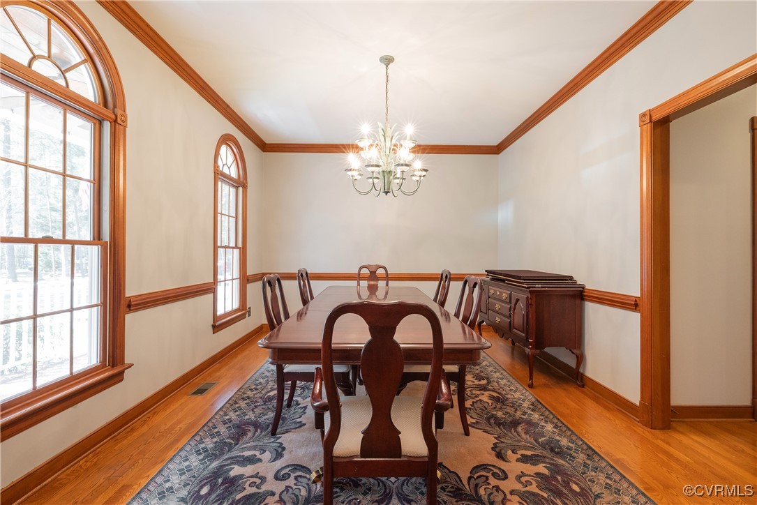 2770 Checketts Drive Sandy Hook, VA 23153 - Photo 13 of 50 a view of a dining room with furniture window and wooden floor