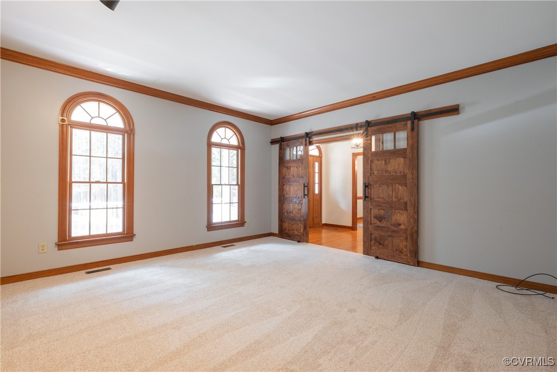 2770 Checketts Drive Sandy Hook, VA 23153 - Photo 17 of 50 an empty room with windows