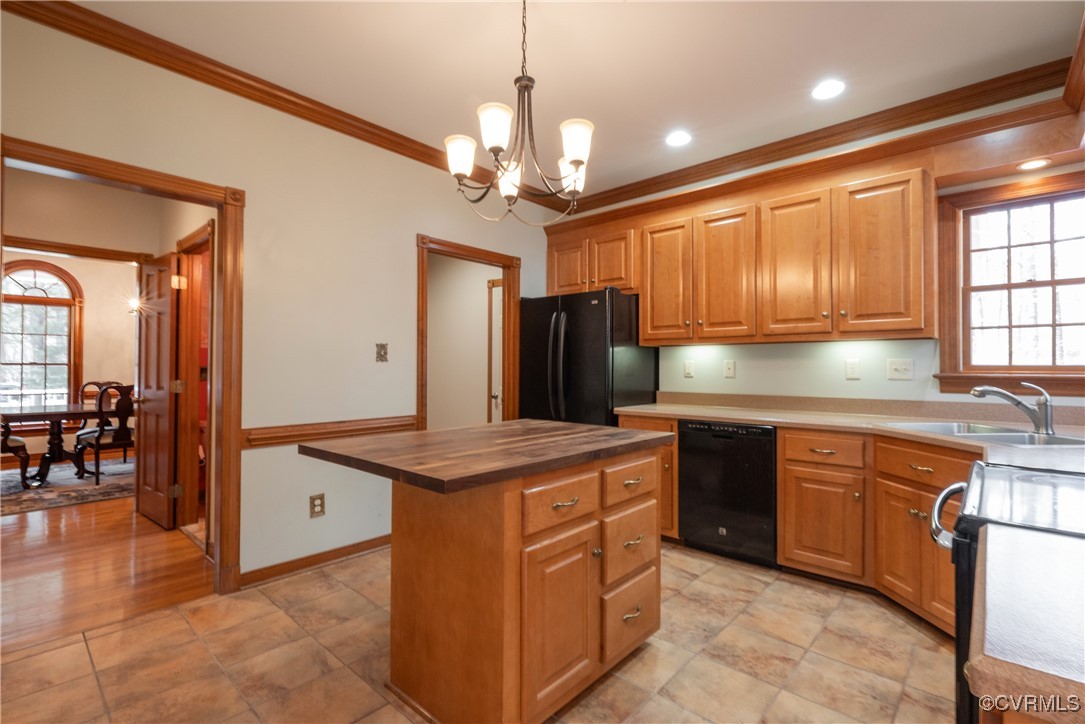 2770 Checketts Drive Sandy Hook, VA 23153 - Photo 24 of 50 a kitchen with stainless steel appliances granite countertop a sink a stove and a wooden cabinets