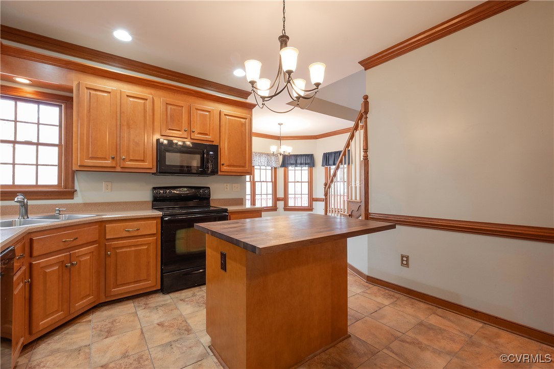 2770 Checketts Drive Sandy Hook, VA 23153 - Photo 25 of 50 a kitchen with stainless steel appliances granite countertop a sink a stove and a refrigerator