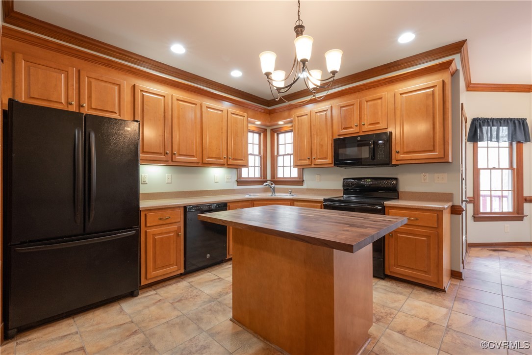 2770 Checketts Drive Sandy Hook, VA 23153 - Photo 26 of 50 a kitchen with stainless steel appliances granite countertop a refrigerator a stove a sink a microwave and island