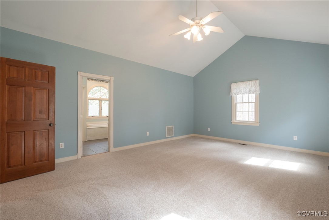 2770 Checketts Drive Sandy Hook, VA 23153 - Photo 28 of 50 a view of a big room with windows and chandelier fan