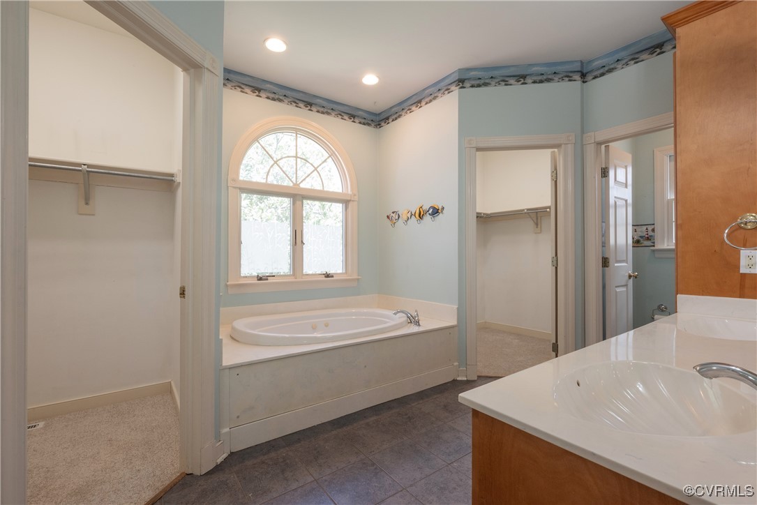 2770 Checketts Drive Sandy Hook, VA 23153 - Photo 29 of 50 a spacious bathroom with a bathtub and a sink