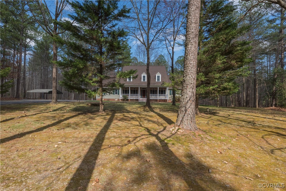 2770 Checketts Drive Sandy Hook, VA 23153 - Photo 3 of 50 a view of a swimming pool with a house
