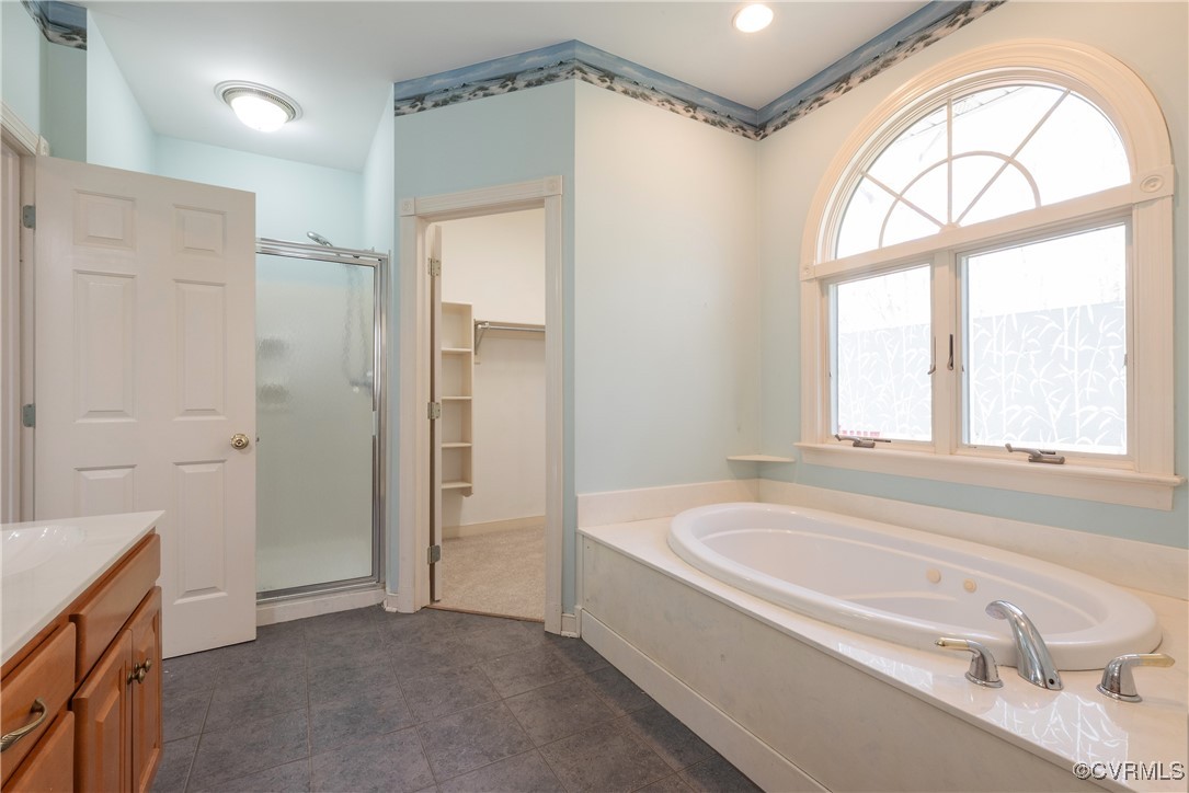 2770 Checketts Drive Sandy Hook, VA 23153 - Photo 31 of 50 a bathroom with a tub a sink and a window