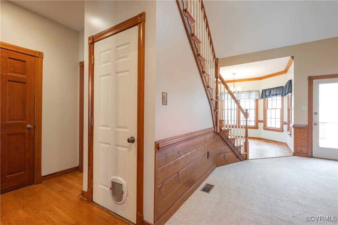 2770 Checketts Drive Sandy Hook, VA 23153 - Photo 35 of 50 wooden floor with an entryway and chandelier in a room