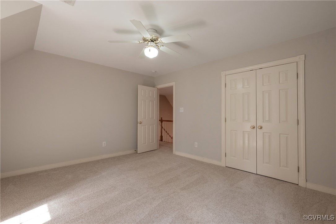 2770 Checketts Drive Sandy Hook, VA 23153 - Photo 42 of 50 a view of an empty room with a chandelier fan