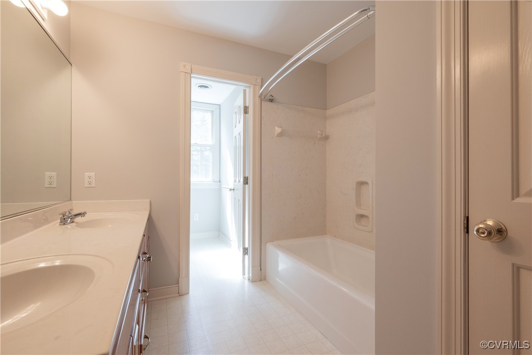 2770 Checketts Drive Sandy Hook, VA 23153 - Photo 43 of 50 a spacious bathroom with a tub sink shower and a mirror