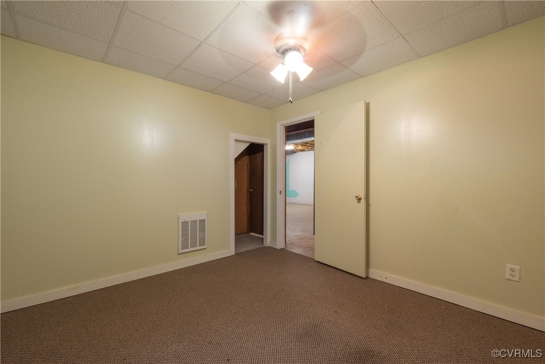 2770 Checketts Drive Sandy Hook, VA 23153 - Photo 45 of 50 an empty room with a empty space and a ceiling fan