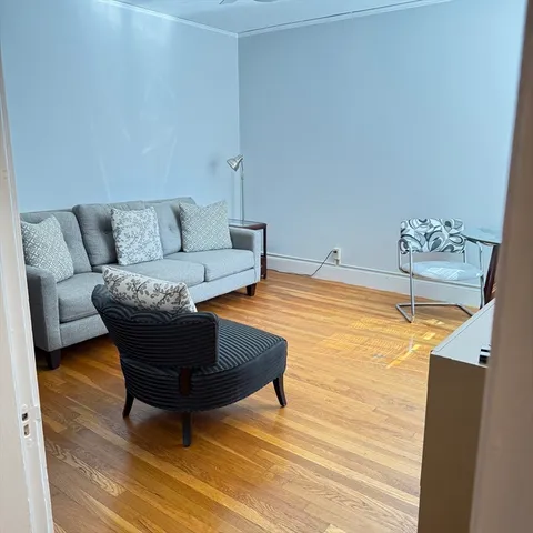 a living room with furniture and a table