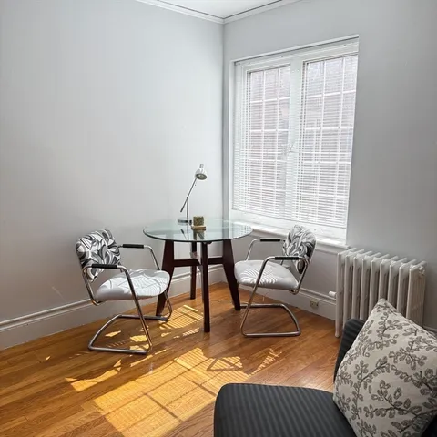 a work room with furniture and a window