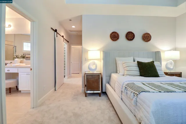 a bedroom with a bed and a cabinets