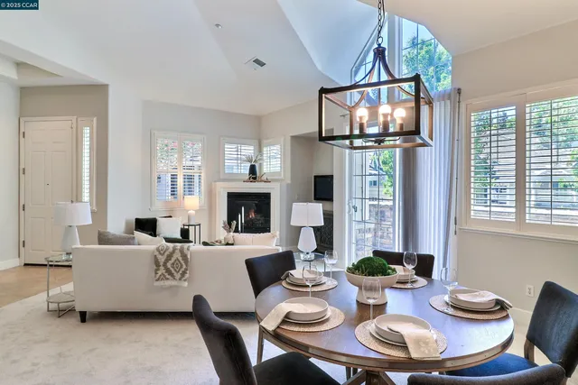 a living room with fireplace furniture and a fireplace