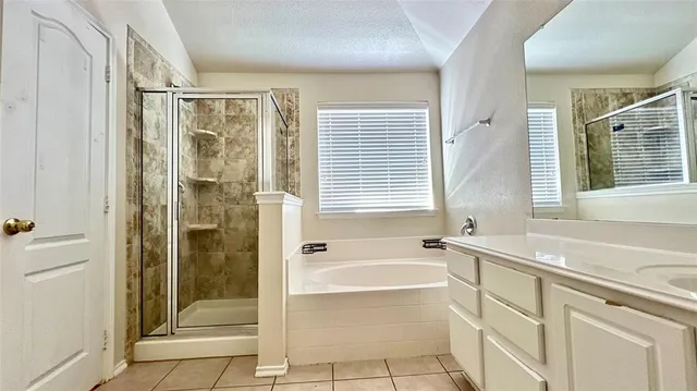 a view of a room with wooden floor and entryway