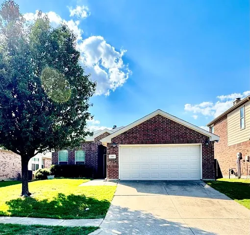 a view of a house with wooden fence