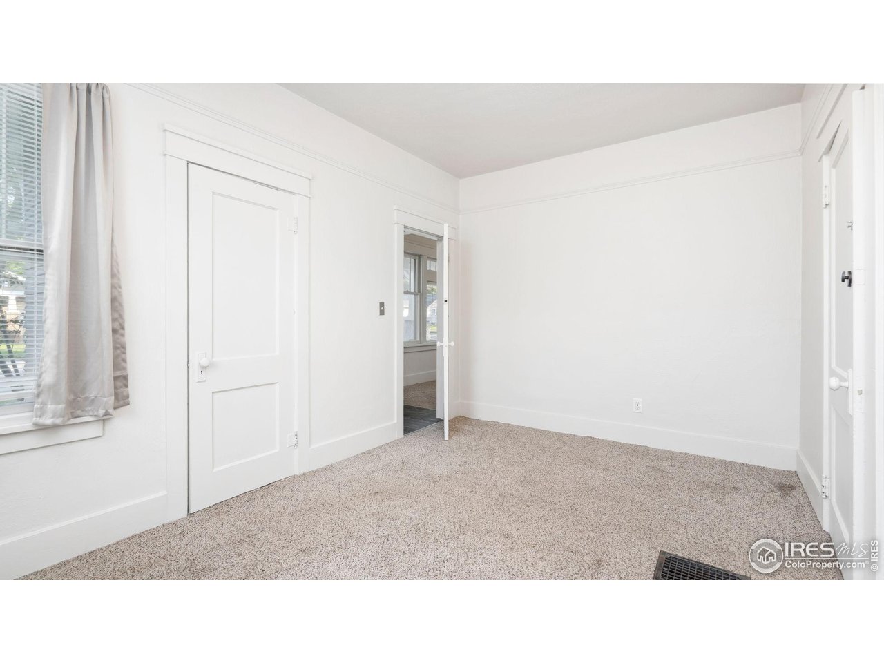 1029 Cranford Place Greeley, CO 80631 - Photo 15 of 34 a open living room with a hallway