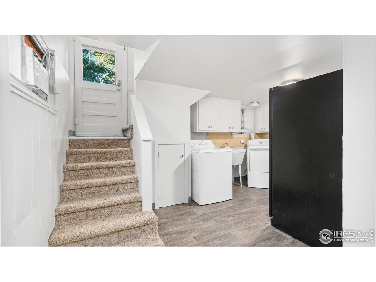 1029 Cranford Place Greeley, CO 80631 - Photo 20 of 34 a black and white photo of a living room