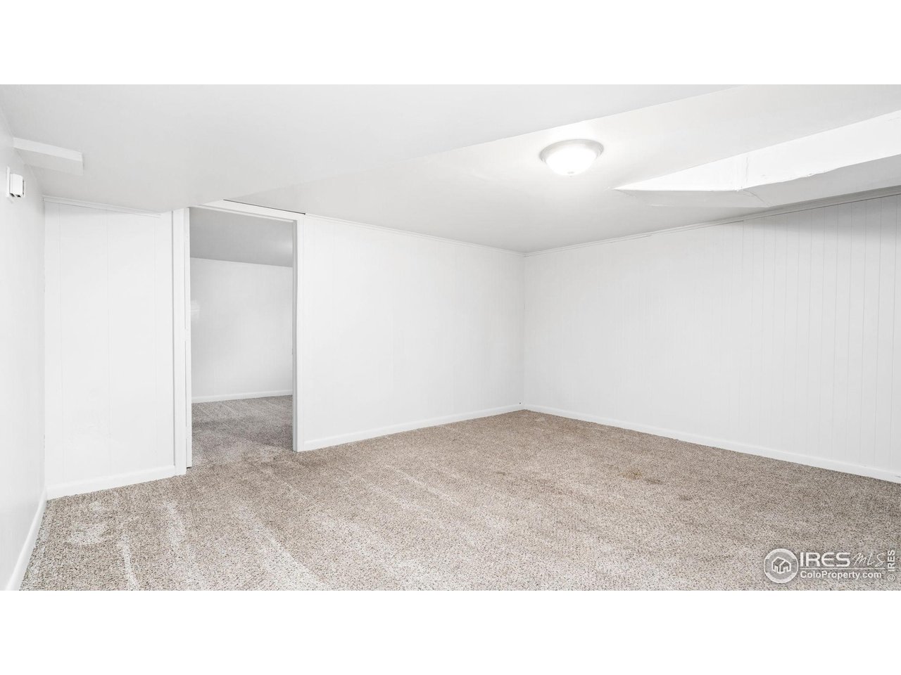 1029 Cranford Place Greeley, CO 80631 - Photo 23 of 34 a open hall with a floor to ceiling window