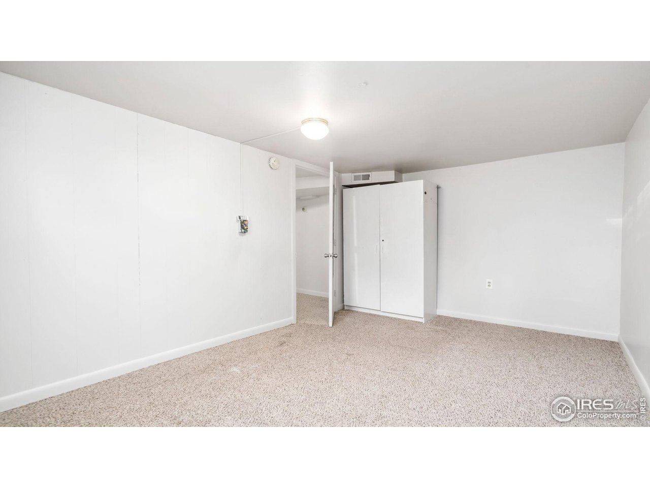 1029 Cranford Place Greeley, CO 80631 - Photo 25 of 34 a open hall with a bench
