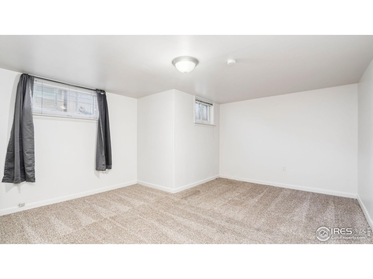 1029 Cranford Place Greeley, CO 80631 - Photo 26 of 34 a black and white photo of a living room