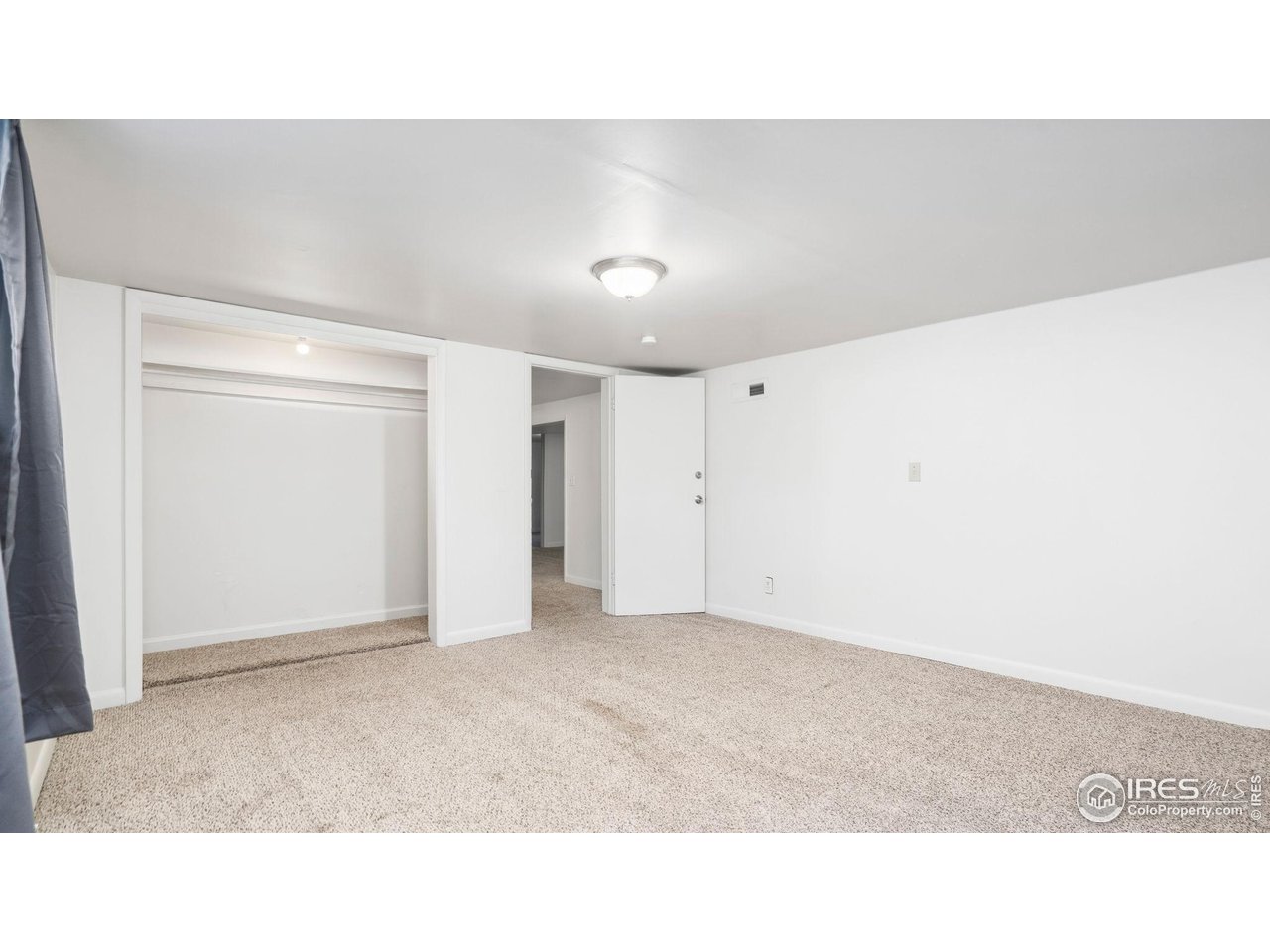 1029 Cranford Place Greeley, CO 80631 - Photo 29 of 34 a open hall with a ceiling fan