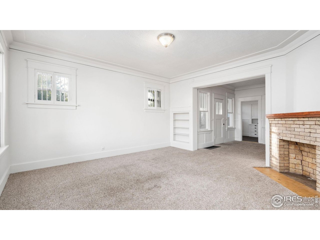 1029 Cranford Place Greeley, CO 80631 - Photo 5 of 34 a open hall with a fireplace