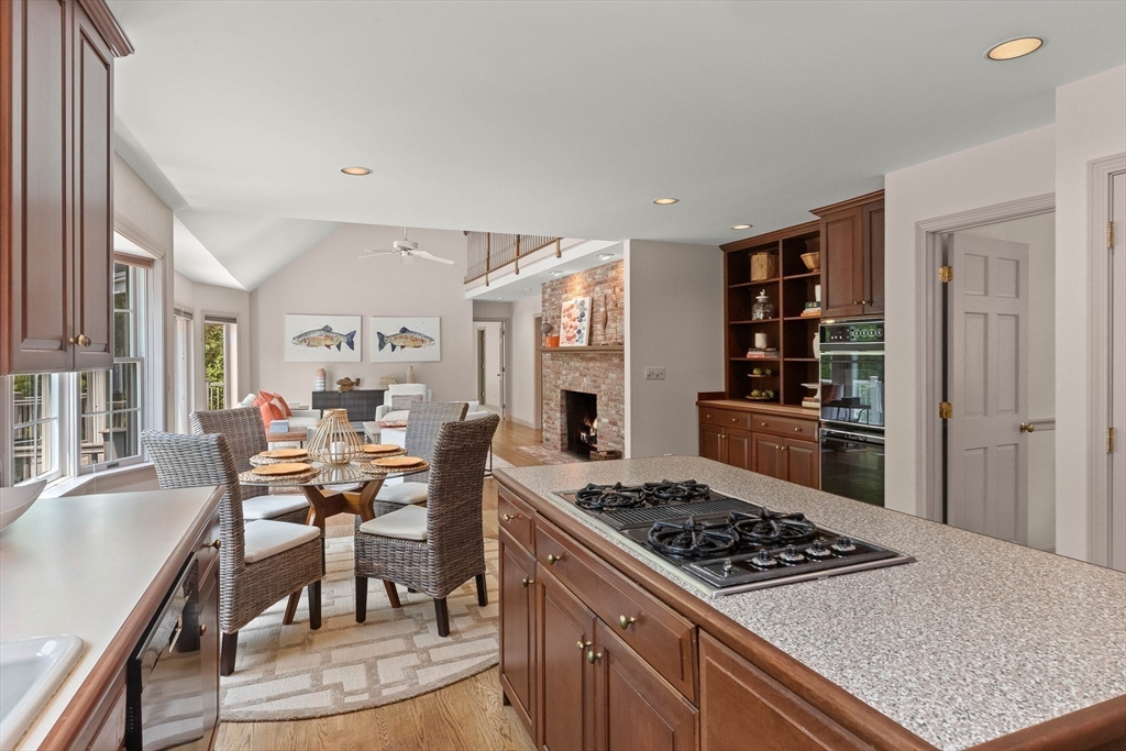 25 Dana Road Boxford, MA 01921 - Photo 11 of 41 a kitchen with stainless steel appliances stove top oven table and chairs